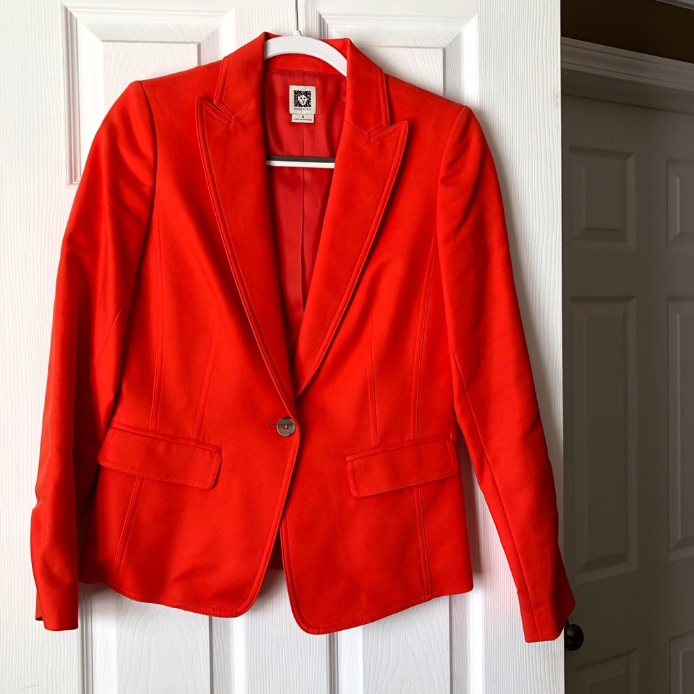 Orange blazer.